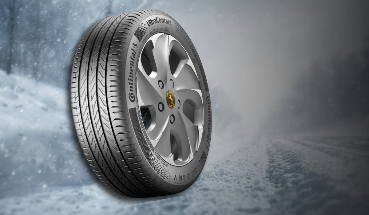 Continental winter tire with detailed tread pattern on a snowy road background