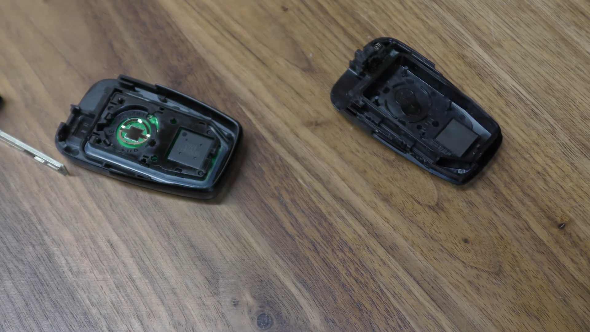 Opened Prius smart key fob with the old coin battery being removed