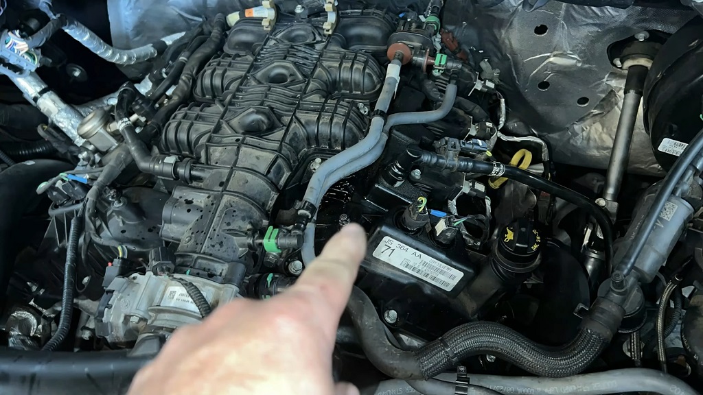 Close-up of Ford F-150 EcoBoost engine with components and hoses visible during inspection