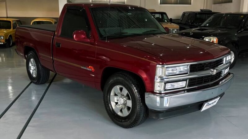 Red Chevy Silverado pickup from 1999–2006 parked indoors
