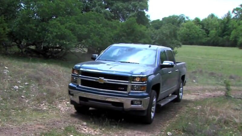Gray Chevy Silverado 2014–2018 driving off road