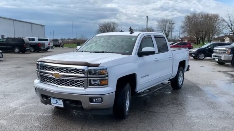White Chevy Silverado parked on a lot, often linked to common Chevy Silverado problems by model year